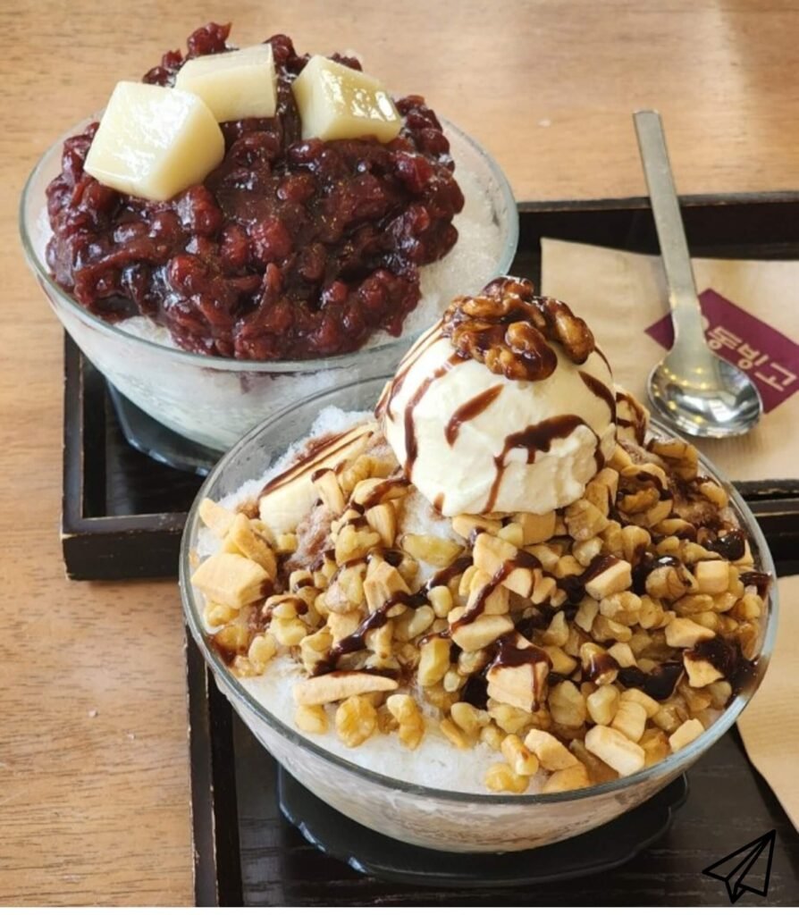 Field shaved ice and cereal shaved ice are served on a plate.