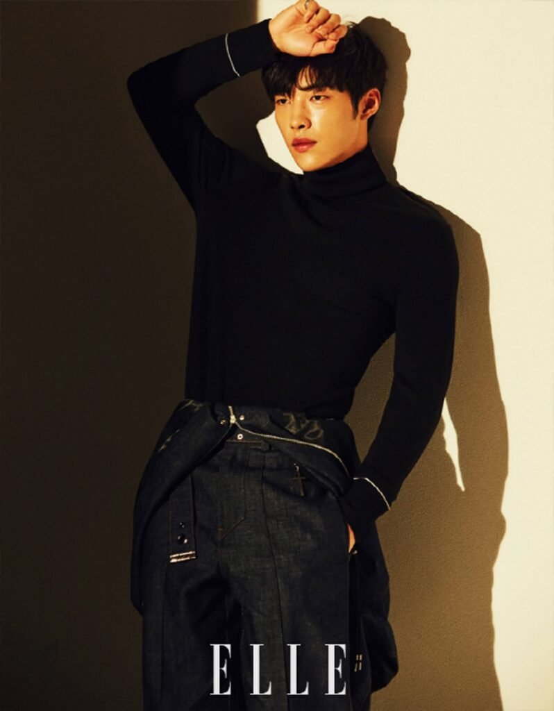 Standing and looking straight ahead during a photo shoot for the cover of an Elle magazine advertisement