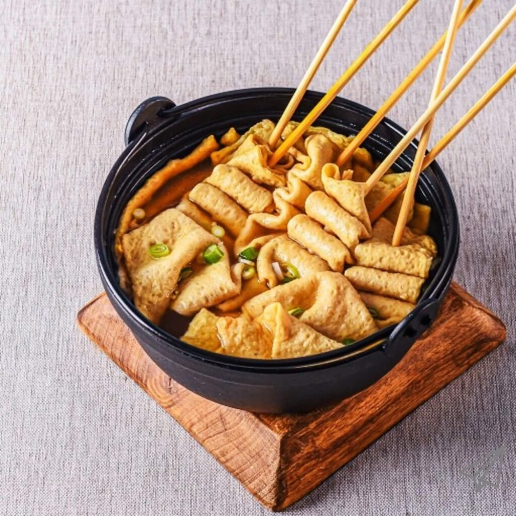 A pot filled with several deliciously cooked fish cakes