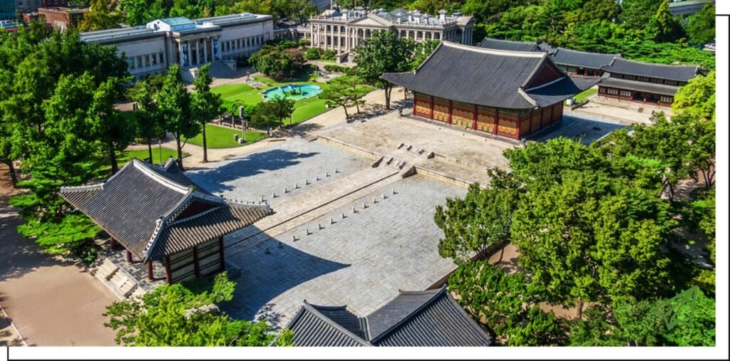 A view looking down at Gyeongbokgung Palace in the summer
