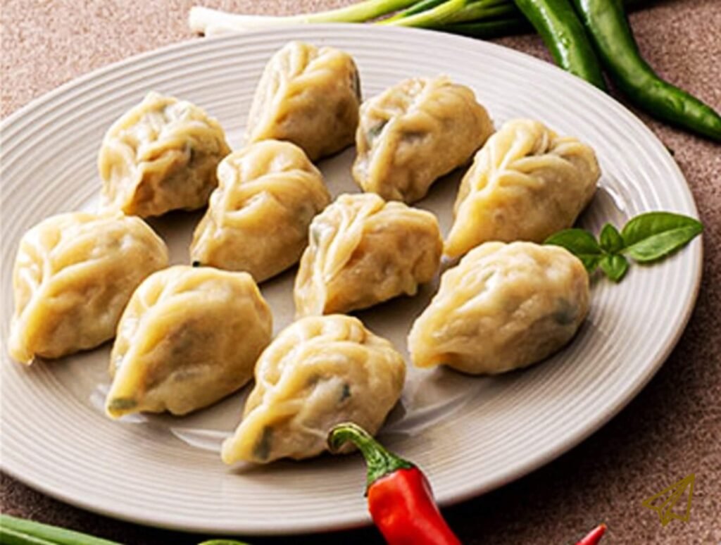 Korean dumplings are beautifully shaped and placed on a plate.