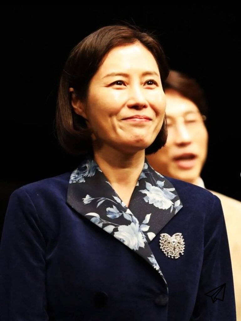 Moon So-ri smiling in a suit