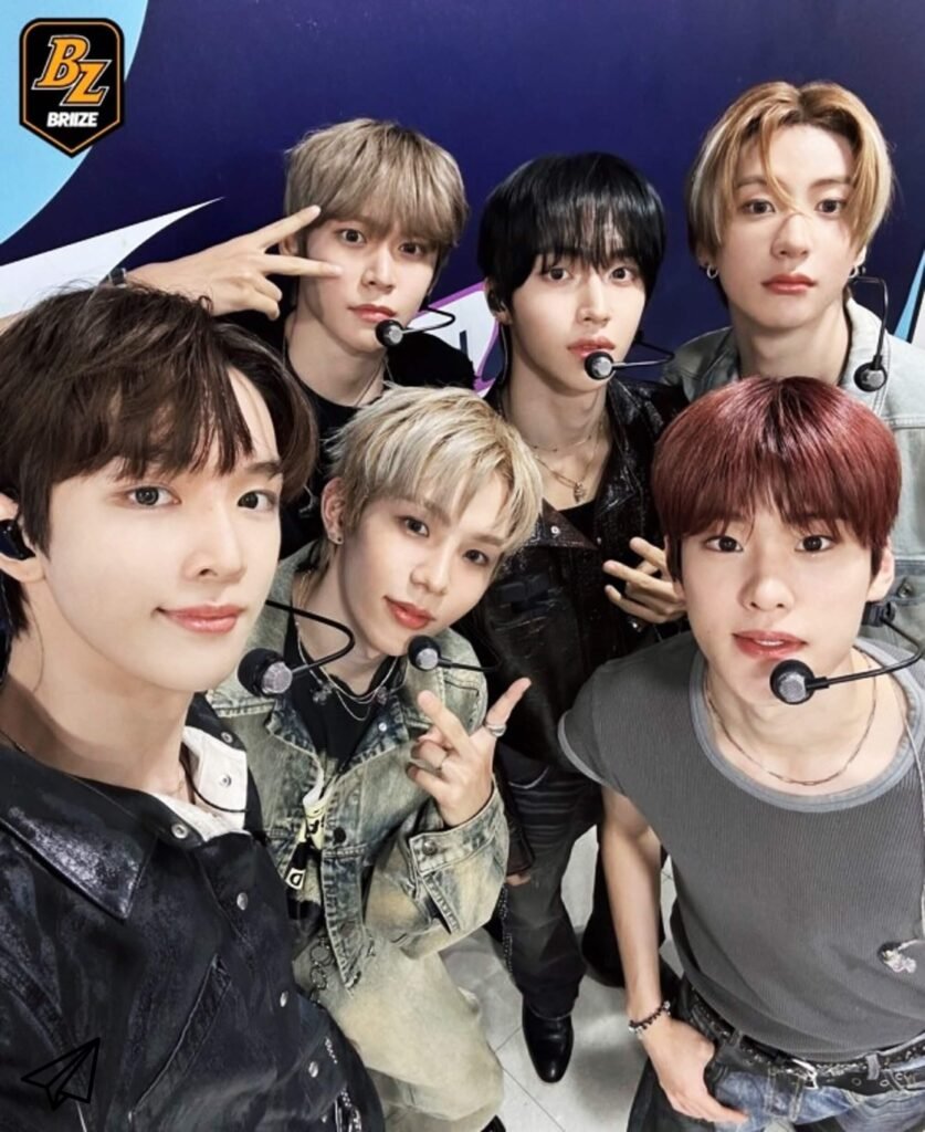 riize members are looking at the camera with headset microphones before broadcasting