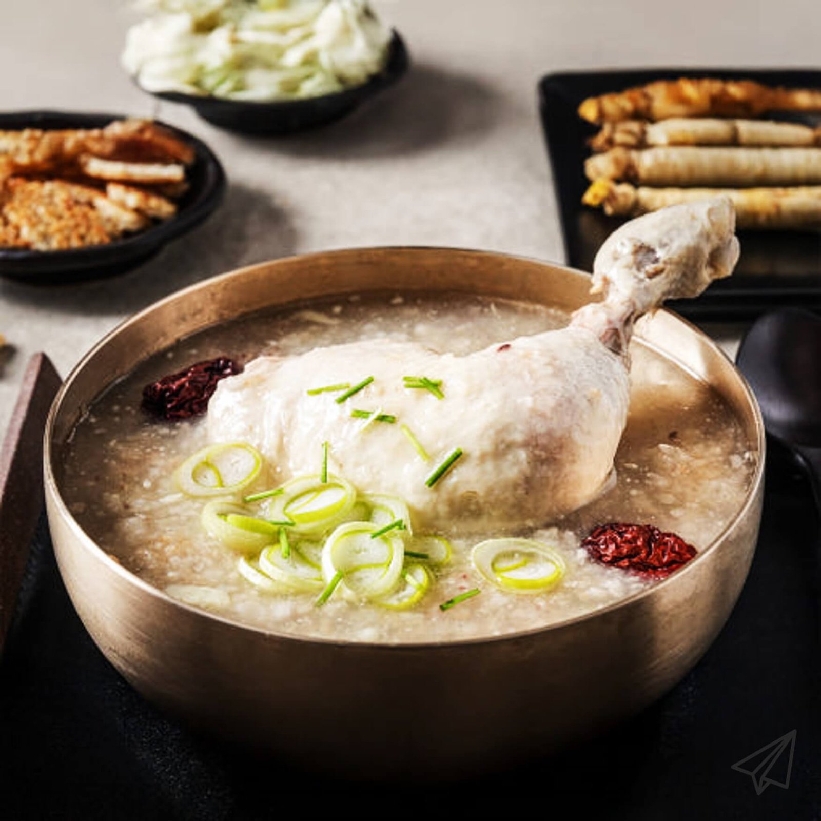 Samgyetang is cooked in a traditional brass bowl.