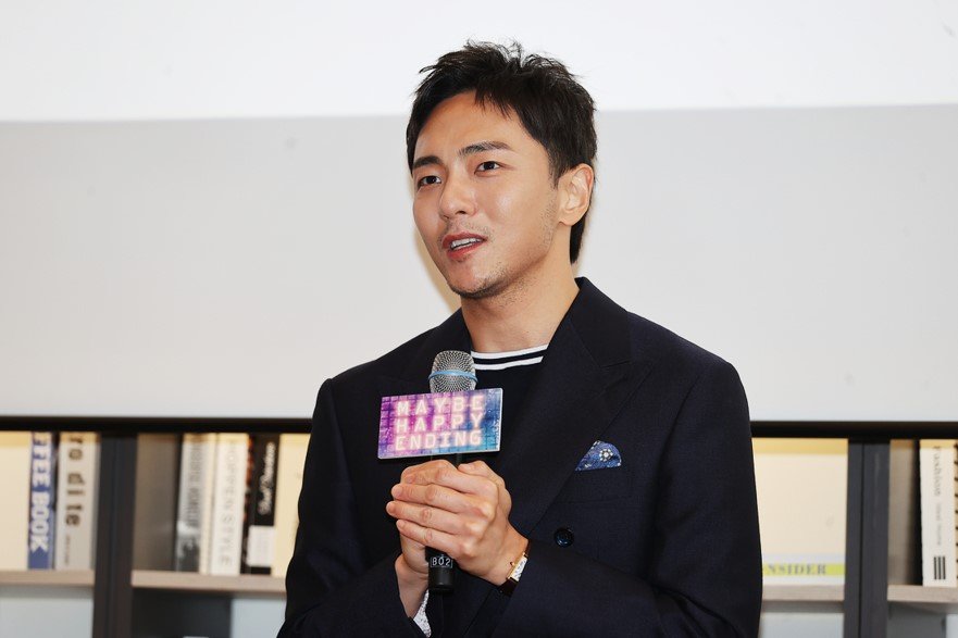 Maybe it's the image of holding a happy ending microphone and being interviewed.